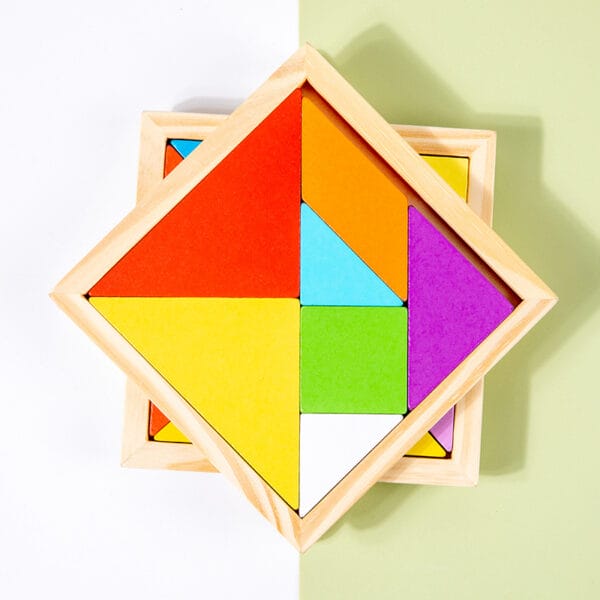 Colorful wooden tangram puzzle in a wooden frame. Montessori learning toy for toddlers.