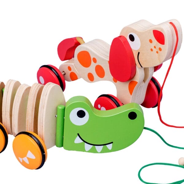 Nachziehspielzeug aus Holz: ein Krokodil und ein gefleckter Hund. Ein Spaß für Kinder!