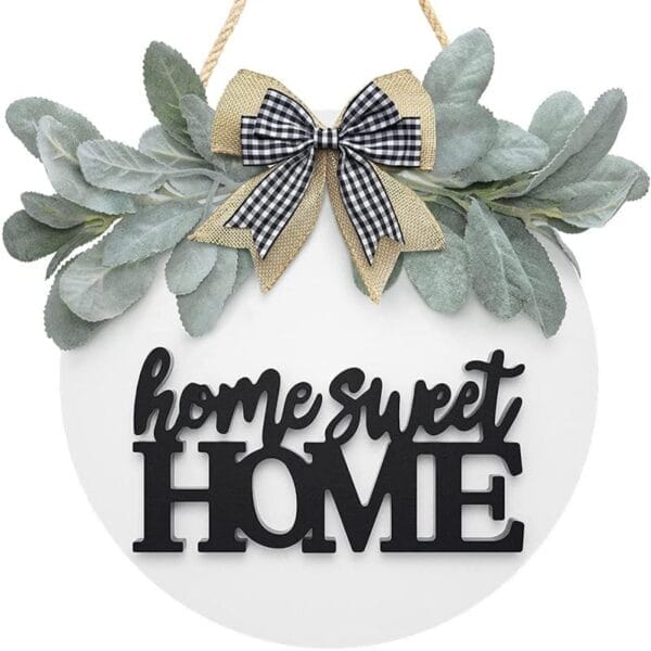 Runde Wanddekoration aus Holz mit „Home Sweet Home“ und Grün.