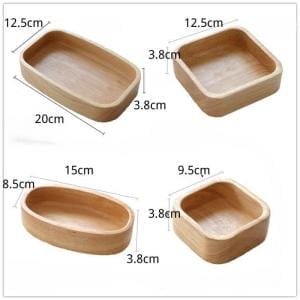 Vier Holzschalen: rechteckige, quadratische und ovale Form. Längliche Holzschalen-Optionen.