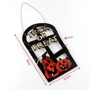 Halloween-Süßes oder Saures-Holzschild mit geschnitzten Kürbissen. Gruselige Halloween-Dekoration.