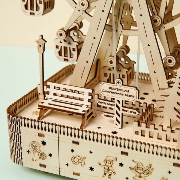 Nahaufnahme eines 3D-Riesenrad-Puzzles aus Holz mit Miniaturparkdetails, einschließlich einer Bank und Wegweisern.