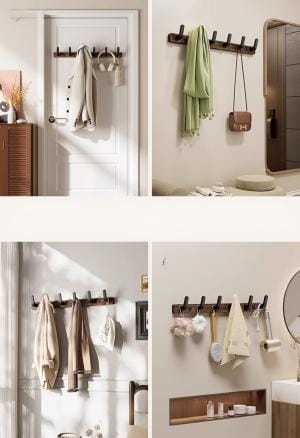 Holz Handtuchhalterung an der Wand mit Jacken und Handtüchern. Wandhaken für Ordnung.