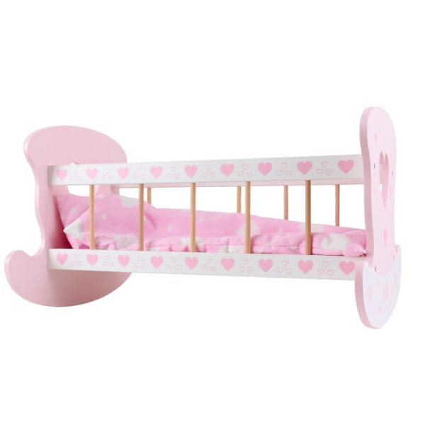 Rosa Puppenwiege aus Holz mit Herzchen-Dekor und Kissen. Perfekt für Kinder.